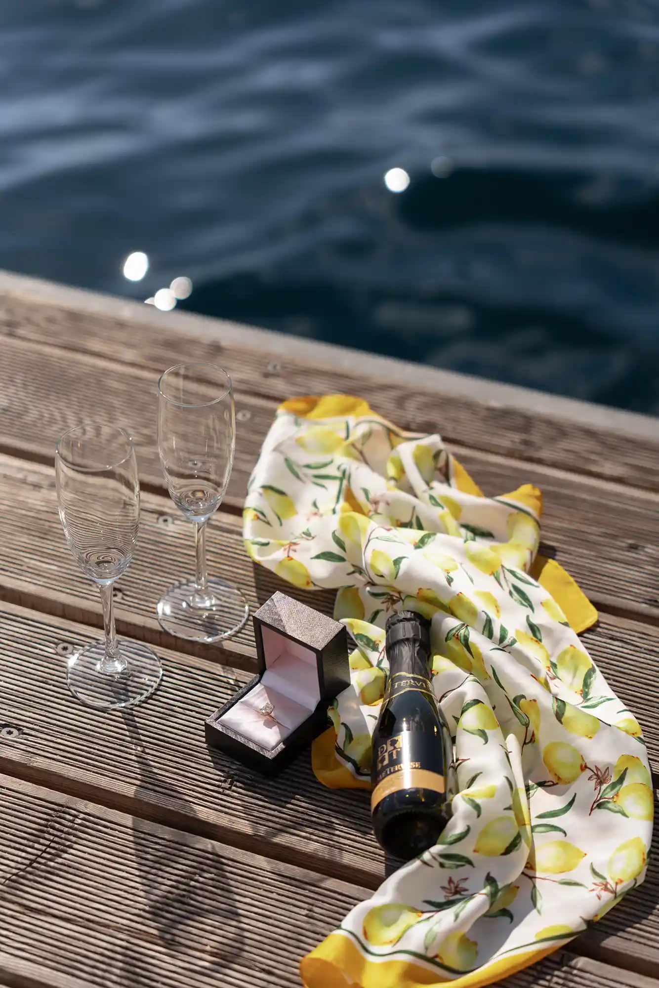 engagement ring and mini prosecco bottle