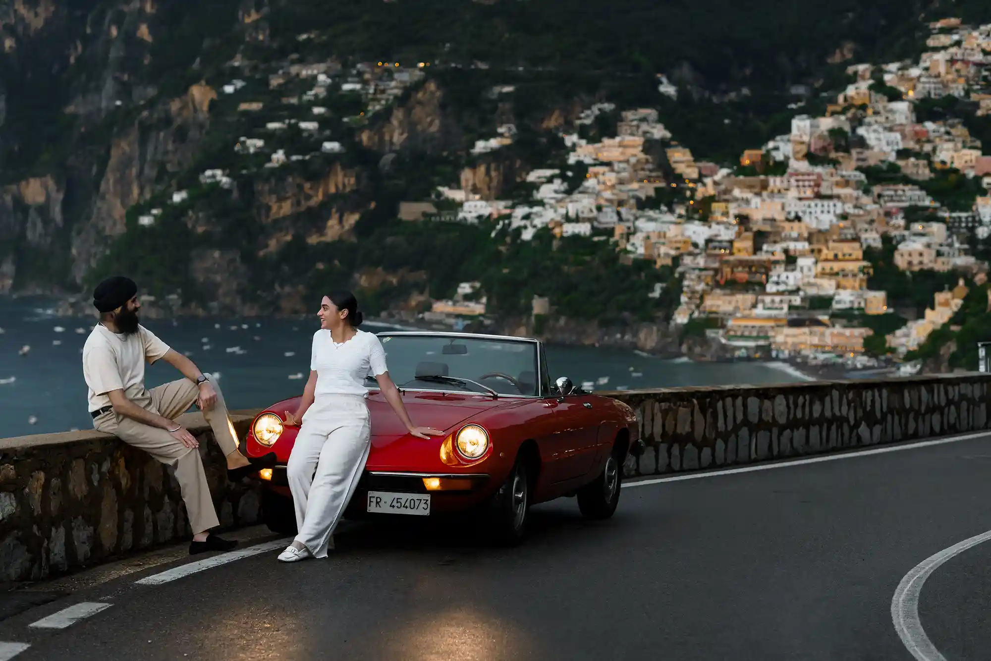 engaged couple on italian coastline in Positano Amalfi coast