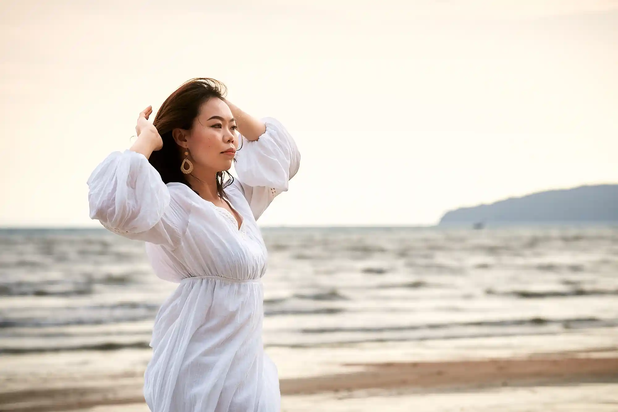 A gorgeous Asian young woman against the sea